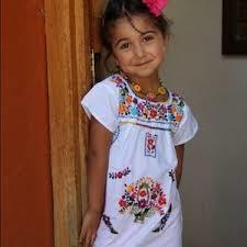 child in Mexican dress
